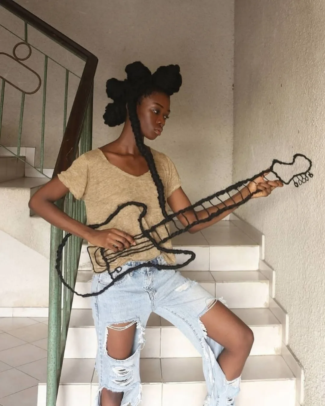 Laetitia Ky, a feminist artist from Ivory Coast, creates stunning art using her own hair. With wire and thread, she sculpts it into detailed, sketch-like designs.Inspired by traditional African hairst...