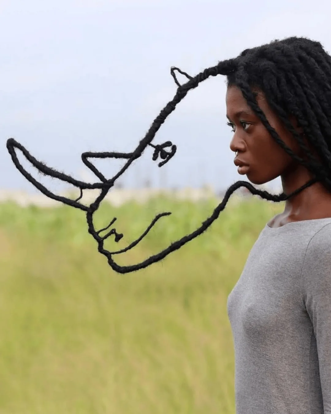 Laetitia Ky, a feminist artist from Ivory Coast, creates stunning art using her own hair. With wire and thread, she sculpts it into detailed, sketch-like designs.Inspired by traditional African hairst...
