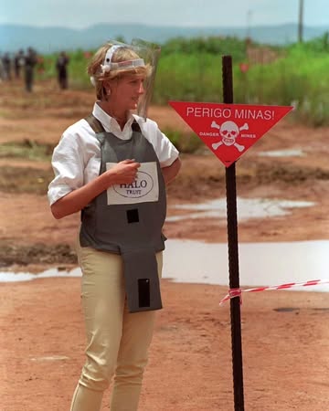 In January 1997, Princess Diana traveled to Angola with the humanitarian organization HALO Trust. She famously walked through a live minefield wearing protective gear to draw global attention to the d...